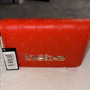 bebe Orange Embossed Logo Wristlet with Gold-Tone Hardware